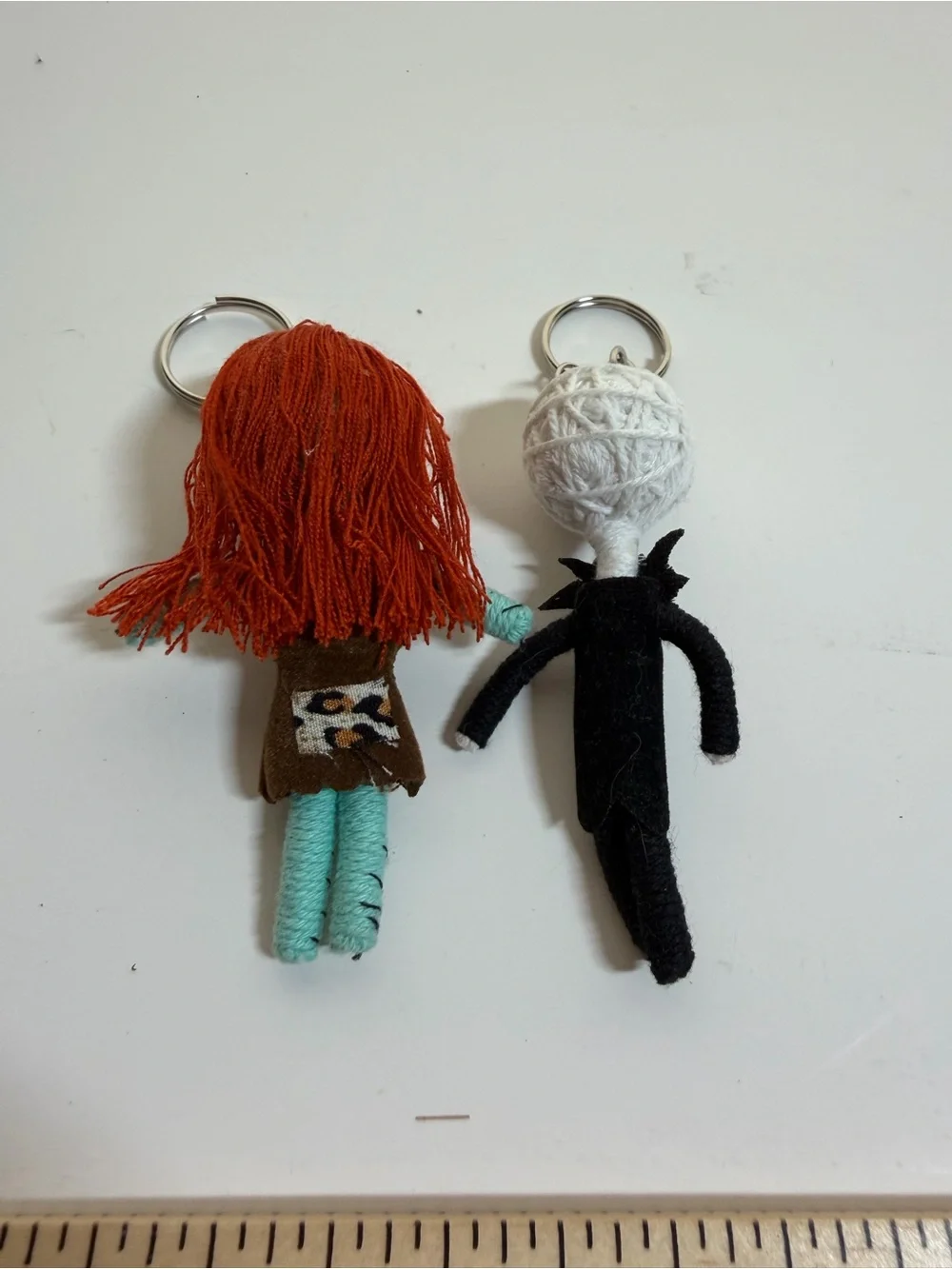 Jack Skellington and Sally string doll keychains. Backpack